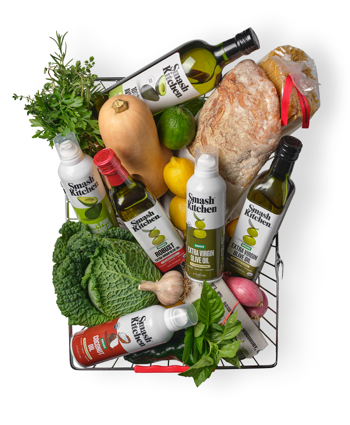 Basket filled with groceries including bottles of Smash Kitchen olive oil and other ingredients on a white background